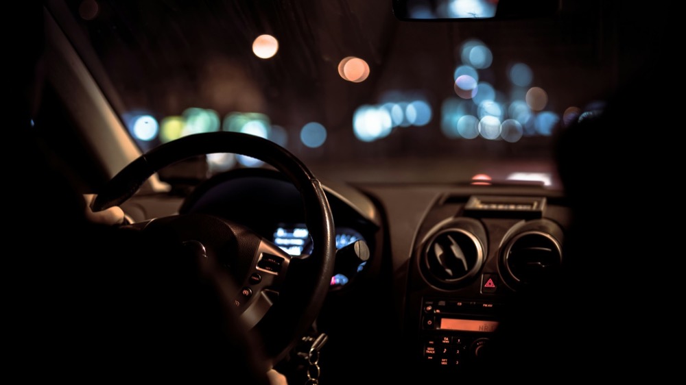 A car dashboard lit at night