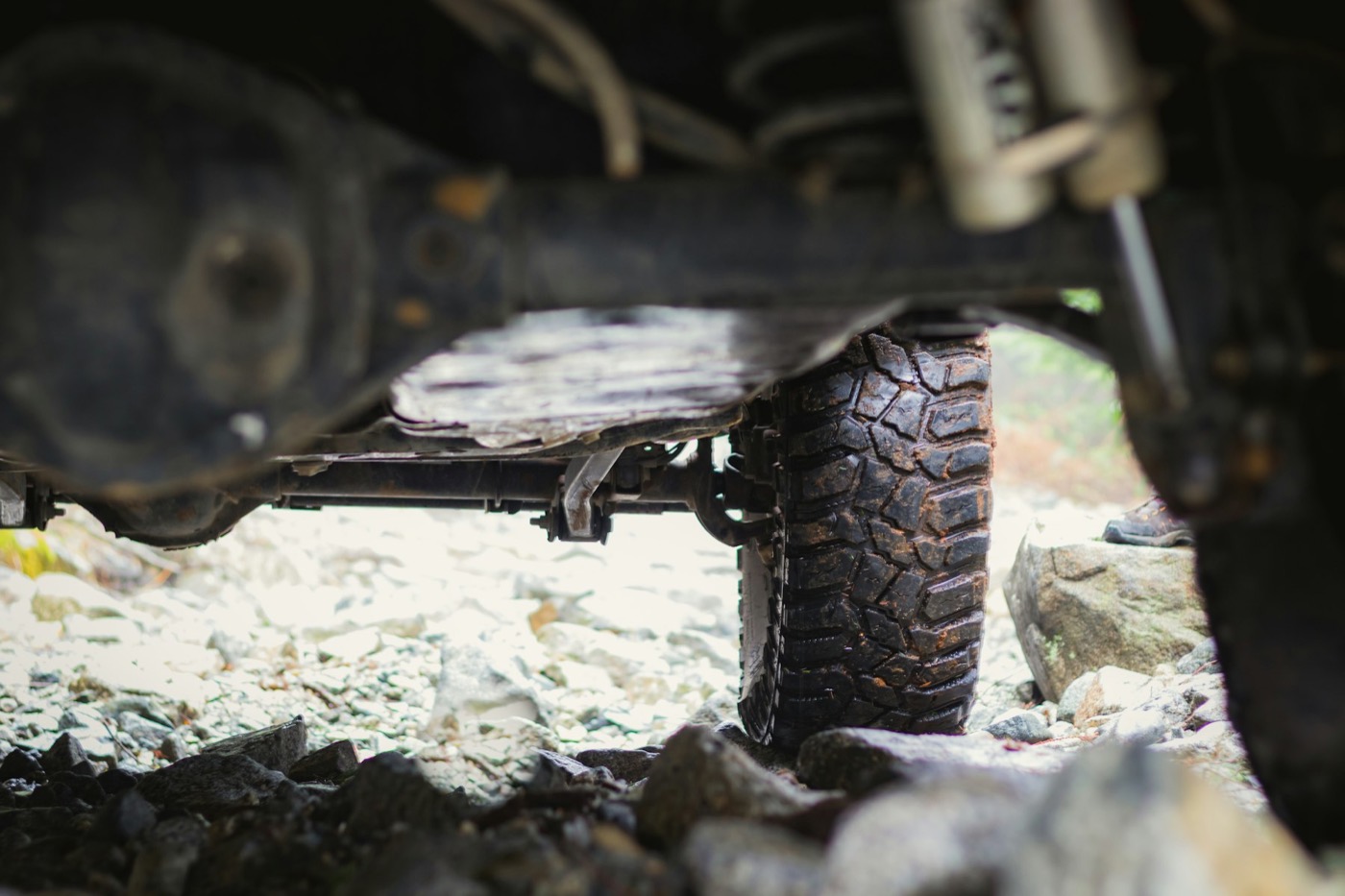 The suspension and wheel of a car seen from underneath